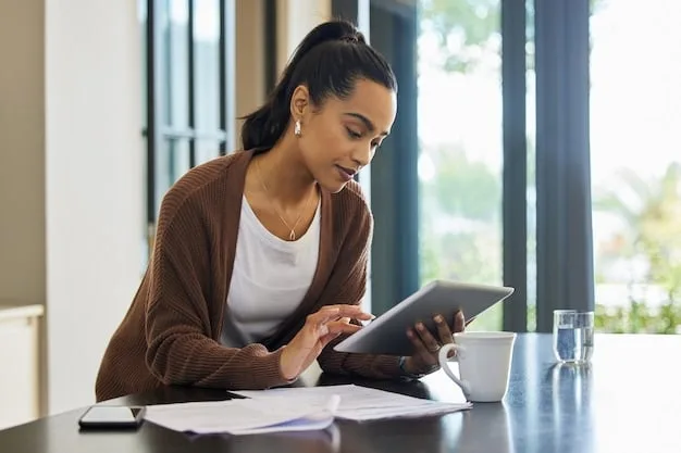 A student working on their FAFSA application on a tablet, with a stack of financial documents and a calculator nearby.