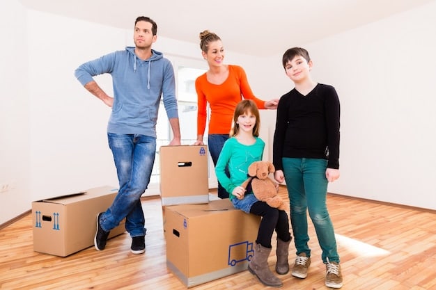 A family moving into a new home with boxes and furniture, symbolizing the portability aspect of the Section 8 program and the opportunity for families to relocate to better neighborhoods. The home should be in a safe and well-maintained area.