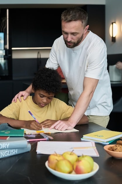 A father helping his child with homework at a table, with books and school supplies around them.