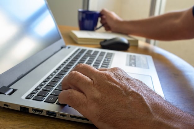 A close-up of hands typing on a laptop, researching state benefit programs, highlighting the importance of online resources.