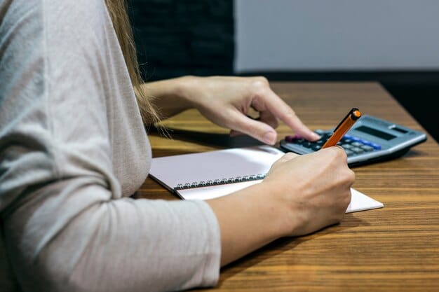 A person carefully filling out a state benefit application form at a desk, with a calculator and pen nearby. The image should emphasize attention to detail and accuracy.