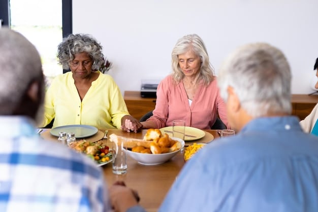 A group of seniors eating lunch together at a community center, with a friendly volunteer serving them nutritious meals.