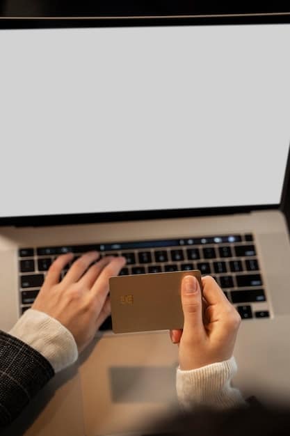 A close-up of a person's hands typing on a laptop, with a website displaying a grid of state benefit programs. Soft, natural light illuminates the scene.