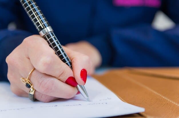 A person carefully filling out a government benefits application form with a pen, highlighting the importance of accuracy and attention to detail in the process.