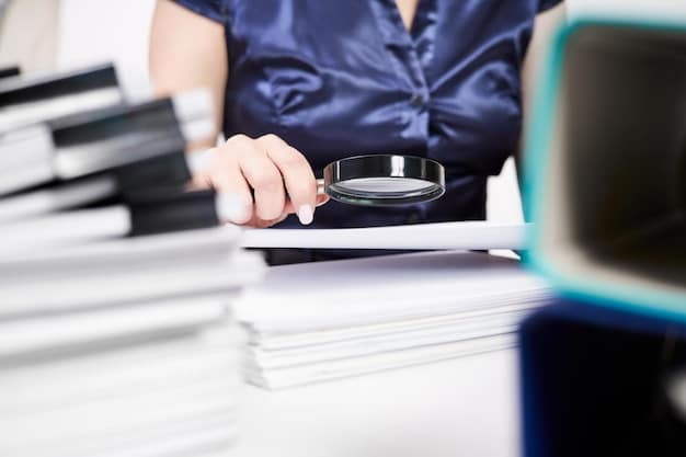 A person reviewing a detailed document with a magnifying glass, highlighting keywords and important sections. The background shows stacks of files and paperwork related to grant applications.