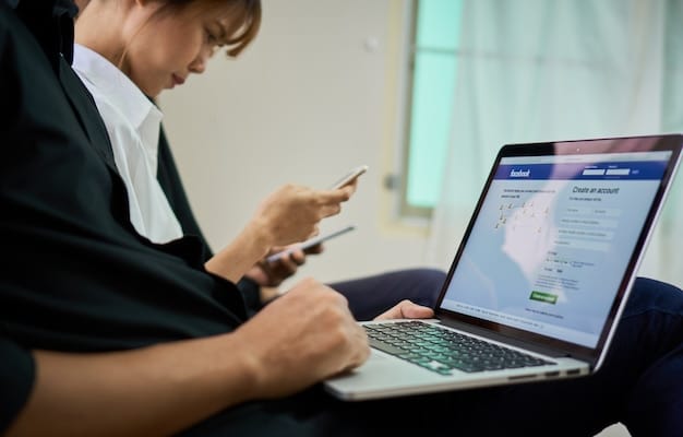 A person using a laptop to navigate a government agency's website, looking for contact information and application tracking tools. The screen shows a clear and user-friendly interface with various options for assistance.