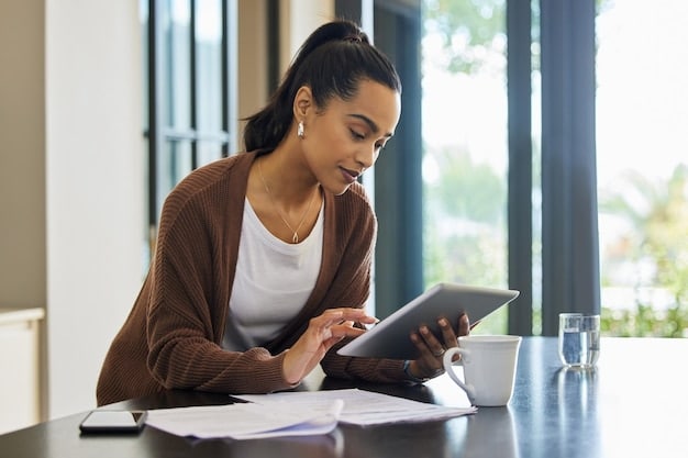 A student working on their FAFSA application on a tablet, with a stack of financial documents and a calculator nearby.