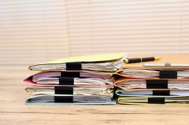 A close-up shot of organized financial documents, including receipts, utility bills, and bank statements, neatly stacked on a desk. A hand is pointing to a specific expense highlighted in one of the documents, emphasizing the importance of detail and accuracy.