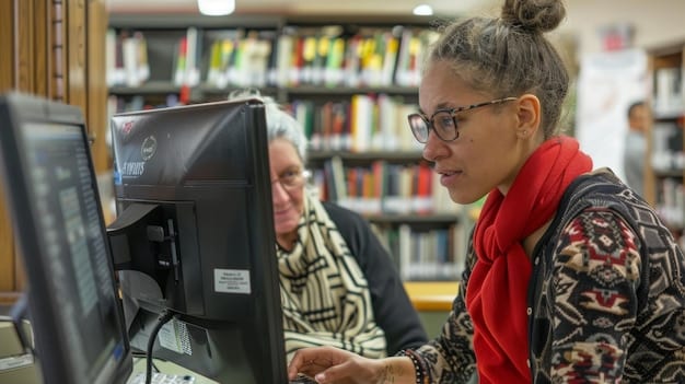 A person smiling warmly while pointing to a computer screen displaying a local government website. The setting is a library or community center, emphasizing accessibility and community support.